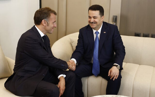 French President Emmanuel Macron, left, attends a bilateral meeting with Iraqi Prime Minister Mohammed Shia al-Sudani on the sidelines of the Gaza International Peace Summit, in Sharm el-Sheikh, Egypt, October 13 2025. (Yoan Valat, Pool photo via AP)
