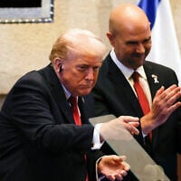 US President Donald Trump addresses Israeli lawmakers at the Knesset, as Speaker Amir Ohana applauds, October 13, 2025, in Jerusalem. (Jalaa Marey/Pool Photo via AP)