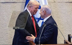 US President Donald Trump (left) talks with Prime Minister Benjamin Netanyahu in the Knesset, October 13, 2025. (Evelyn Hockstein/Pool via AP)