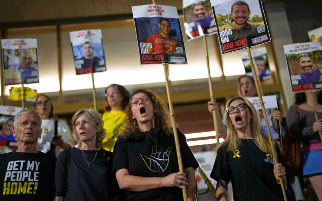 Relatives of hostages whose bodies are still in Gaza Strip shout slogans calling for their release, at Hostages Square in Tel Aviv, October 14, 2025. (AP Photo/Francisco Seco)