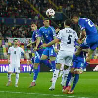 Italy's Gianluca Mancini, right, scores his side's third goal during the World Cup 2026 Group I qualifying soccer match between Italy and Israel at the Bluenergy Stadium in Udine, Italy, October 14, 2025. (AP Photo/Luca Bruno)