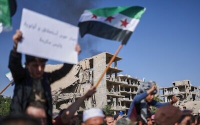 Residents of Damascus' Jobar neighborhood protest, demanding investment to rebuild the area, in Damascus, Syria, October 15, 2025. (AP Photo/Ghaith Alsayed)