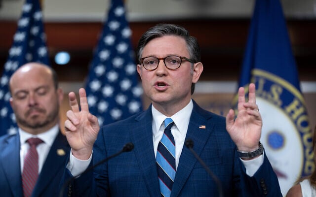 US House Speaker Mike Johnson, joined at left by US Rep. Andrew Garbarino, gestures as he answers questions during a press conference on the sixteenth day of a government shutdown, at the Capitol in Washington, October 16, 2025. (AP/J. Scott Applewhite)