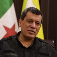 Mazloum Abdi, commander of the Kurdish-led and US-backed Syrian Democratic Forces speaks during an interview with the Associated Press, in the northeastern city of Hassakeh, Syria, Thursday, October 16, 2025. (AP Photo/Hogir Al Abdo)