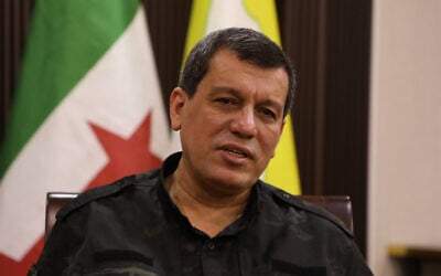 Mazloum Abdi, commander of the Kurdish-led and US-backed Syrian Democratic Forces speaks during an interview with the Associated Press, in the northeastern city of Hassakeh, Syria, Thursday, October 16, 2025. (AP Photo/Hogir Al Abdo)
