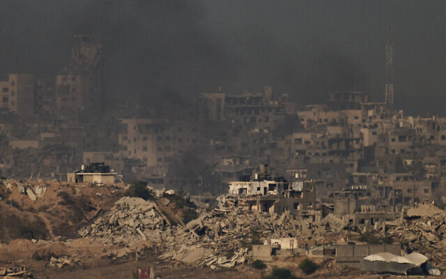 Buildings that were destroyed during the fighting between Israel and Hamas are seen in the northern Gaza Strip during the sunrise, as seen from southern Israel, October 17, 2025. (AP Photo/Leo Correa) Buildings that were destroyed during the fighting between Israel and Hamas are seen in the northern Gaza Strip during the sunrise, as seen from southern Israel, October 17, 2025. (AP Photo/Leo Correa)