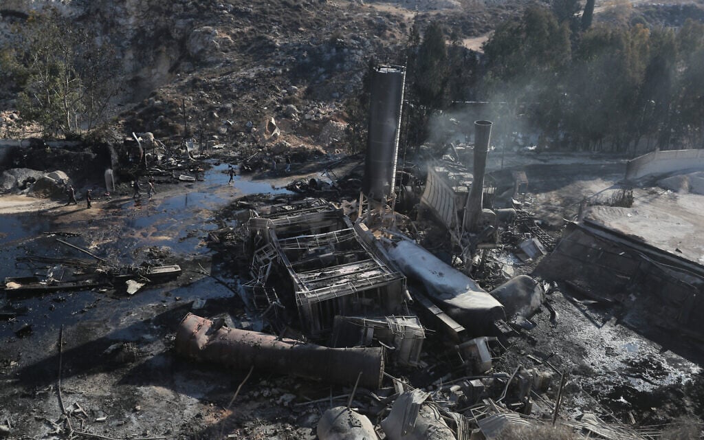 People inspect the damage at a cement manufacturing complex a day after a series of Israeli airstrikes in the southern Lebanese village of Ansar on October 17, 2025, which the IDF said had targeted Hezbollah facilities (AP Photo/Mohammad Zaatari)