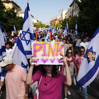 Mourners walk near the van carrying the coffin of slain hostage Inbar Haiman, know as 'Pink' in the local graffiti community, during her funeral procession in Rishon Lezion, October 17, 2025. (AP Photo/Francisco Seco)