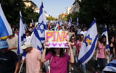 Mourners walk near the van carrying the coffin of slain hostage Inbar Haiman, know as 'Pink' in the local graffiti community, during her funeral procession in Rishon Lezion, October 17, 2025. (AP Photo/Francisco Seco)