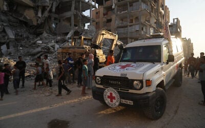A Red Cross vehicle arrives at the site where Hamas operatives work on searching for bodies of the hostages in an area in Hamad City, Khan Younis, in the southern Gaza Strip, October 17, 2025. (AP Photo/Abdel Kareem Hana) A Red Cross vehicle arrives at the site where Hamas operatives work on searching for bodies of the hostages in an area in Hamad City, Khan Younis, in the southern Gaza Strip, October 17, 2025. (AP Photo/Abdel Kareem Hana)