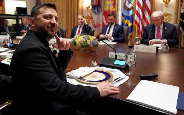 Ukraine's President Volodymyr Zelensky, left, sits before a meeting with US President Donald Trump, from right, Vice President JD Vance and Treasury Secretary Scott Bessent in the Cabinet Room of the White House,  Oct. 17, 2025, in Washington. (AP Photo/Alex Brandon)
