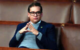 Then-Rep. George Santos, a New York Republican since sentenced to seven years in jail for fraud, waits for the start of a session in the US House chamber in Washington, January 6, 2023. (AP Photo/Alex Brandon, File)