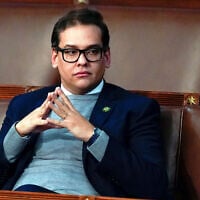 Then-Rep. George Santos, a New York Republican since sentenced to seven years in jail for fraud, waits for the start of a session in the US House chamber in Washington, January 6, 2023. (AP Photo/Alex Brandon, File)