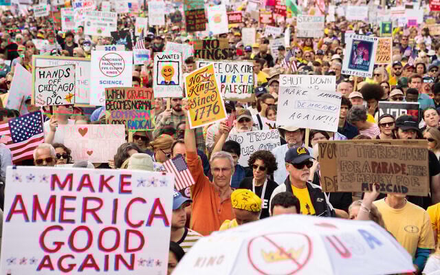 Crowds gather to listen to Sen. Bernie Sanders, an Independent of Vermont, during a No Kings protest, in Washington, October 18, 2025. (Allison Robbert/AP)