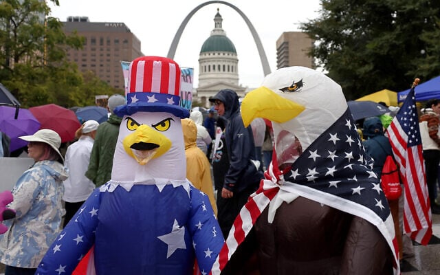 Demonstrators wearing inflatable bald eagle costumes gather in Kiener Plaza during the 'No King' protest in St. Louis, with the Gateway Arch in the background, October 18, 2025. (David Carson/St. Louis Post-Dispatch via AP) Demonstrators wearing inflatable bald eagle costumes gather in Kiener Plaza during the 'No King' protest in St. Louis, with the Gateway Arch in the background, October 18, 2025. (David Carson/St. Louis Post-Dispatch via AP)