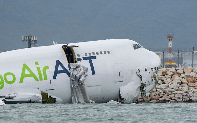 A view of the cargo aircraft that skidded off a Hong Kong runway on Monday, Oct. 20, 2025. (AP Photo/Chan Long Hei)