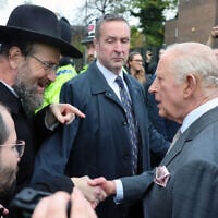 Britain's King Charles III meets members of the community during a visit to Heaton Park Hebrew Congregation Synagogue, in Manchester, England, October 20, 2025. (Chris Jackson, Pool Photo via AP)