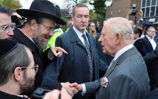 Britain's King Charles III meets members of the community during a visit to Heaton Park Hebrew Congregation Synagogue, in Manchester, England, October 20, 2025. (Chris Jackson, Pool Photo via AP)