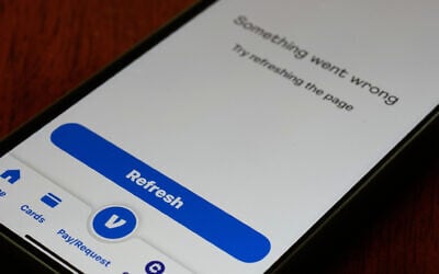 A Venmo mobile app shows it is not available during the Amazon Web Services outage, Monday, Oct. 20, 2025, in Chicago. (AP Photo/Kiichiro Sato)