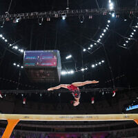 Zhou Yaqin of China competes on the balance beam during the 53rd Artistic Gymnastics World Championships in Jakarta, Indonesia, October 21, 2025. (Dita Alangkara/AP)