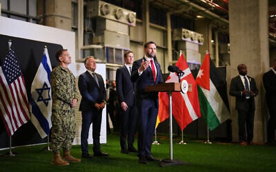 US Vice President JD Vance speaks to the media as US Special Envoy to the Middle East Steve Witkoff and White House adviser Jared Kushner stand next to him, at the Civil-Military Coordination Center in Kiryat Gat, Israel, October 21, 2025. (AP/Francisco Seco)