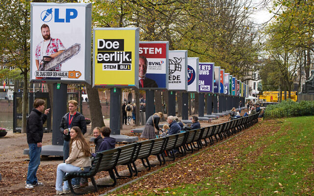 People enjoy the autumn weather next to some of the election billboards of 26 of the 27 political parties participating in the Oct. 29 general elections in The Hague, Netherlands, Wednesday, Oct. 22, 2025. (AP Photo/Peter Dejong) People enjoy the autumn weather next to some of the election billboards of 26 of the 27 political parties participating in the Oct. 29 general elections in The Hague, Netherlands, Wednesday, Oct. 22, 2025. (AP Photo/Peter Dejong)
