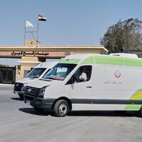 Egyptian ambulances line up as they wait for possible Palestinian arrivals at the Egyptian gate of the Rafah crossing with Gaza, following an agreement between Israel and Hamas on a ceasefire, October 22, 2025. (AP Photo/Mohamed Arafat)
