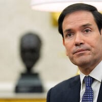 US Secretary of State Marco Rubio listens as President Donald Trump meets with NATO Secretary General Mark Rutte in the Oval Office of the White House, October 22, 2025, in Washington. (AP Photo/Alex Brandon)