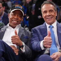 New York City Mayor Eric Adams, left, and former New York governor Andrew Cuomo, right, pose during an NBA basketball game between the New York Knicks and the Cleveland Cavaliers at Madison Square Garden in New York City, October 22, 2025. (AP Photo/Frank Franklin II)