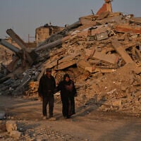 Palestinians walk through the destruction in Gaza City, October 23, 2025. (AP Photo/Abdel Kareem Hana)