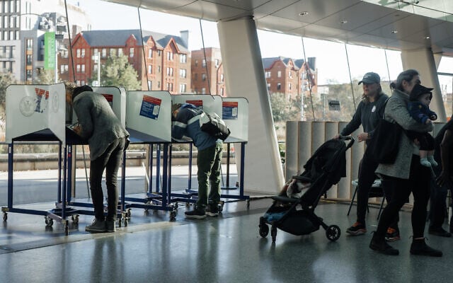 People cast their ballots during early voting, October 25, 2025, in New York. (AP Photo/Olga Fedorova)