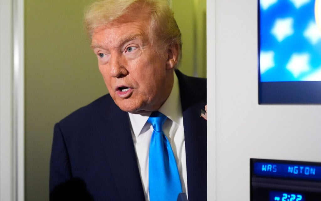 US President Donald Trump speaks with reporters aboard Air Force One at Al Udeid Air Base in Doha, Qatar, October 25, 2025. (AP Photo/Mark Schiefelbein)