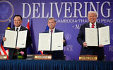 US President Donald Trump, Cambodian Prime Minister Hun Manet, left, and Thailand's Prime Minister Anutin Charnvirakul pose with their documents during a signing ceremony on the sidelines of the ASEAN Summit in Kuala Lumpur, Malaysia, October 26, 2025. (AP Photo/Mark Schiefelbein)