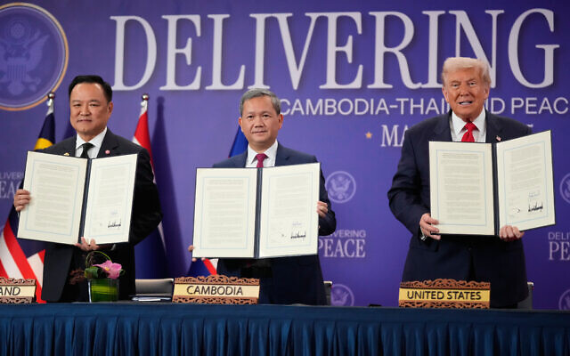 US President Donald Trump, Cambodian Prime Minister Hun Manet, left, and Thailand's Prime Minister Anutin Charnvirakul pose with their documents during a signing ceremony on the sidelines of the ASEAN Summit in Kuala Lumpur, Malaysia, October 26, 2025. (AP Photo/Mark Schiefelbein) US President Donald Trump, Cambodian Prime Minister Hun Manet, left, and Thailand's Prime Minister Anutin Charnvirakul pose with their documents during a signing ceremony on the sidelines of the ASEAN Summit in Kuala Lumpur, Malaysia, October 26, 2025. (AP Photo/Mark Schiefelbein)