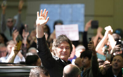Argentine President Javier Milei waves to supporters after voting during legislative midterm elections in Buenos Aires, Argentina, October 26, 2025. (AP/Natacha Pisarenko)