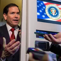 US Secretary of State Marco Rubio speaks to reporters aboard Air Force One while traveling with President Donald Trump from Kuala Lumpur, Malaysia, to Tokyo, Japan, October 27, 2025. (AP Photo/Mark Schiefelbein)