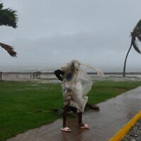 A man walks in Kingston, Jamaica, as Hurricane Melissa approaches, Oct. 28, 2025. (AP/Matias Delacroix)