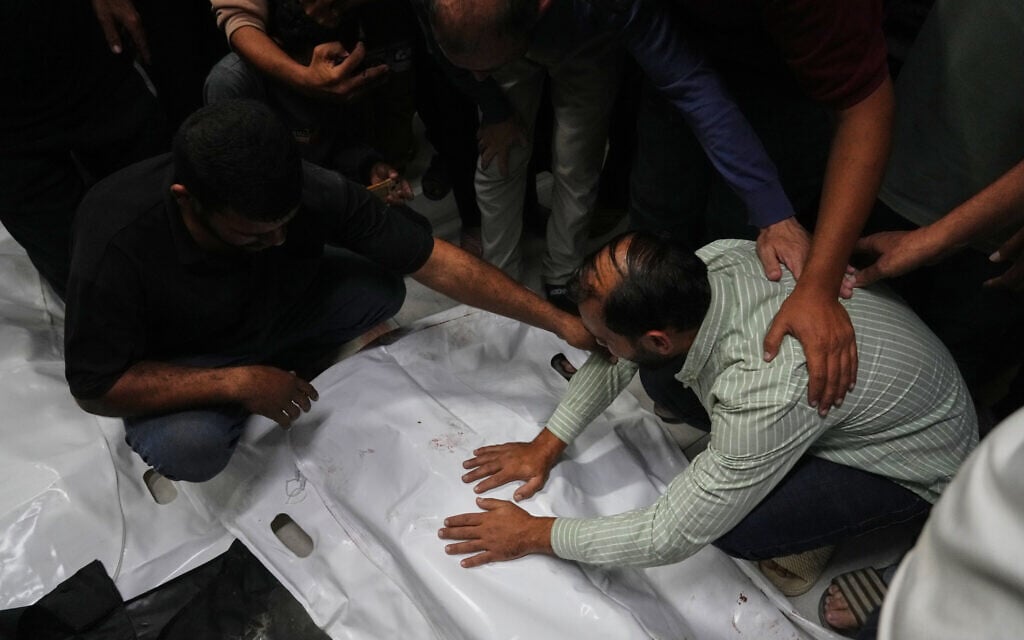 The bodies of Palestinians killed in an Israeli army strike are brought to Nasser Hospital in Khan Younis, Gaza Strip, October 28, 2025. (AP Photo/Jehad Alshrafi)