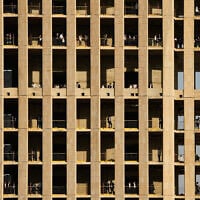 Ultra-Orthodox Jewish men stand on multiple floors of a building under construction and watch a protest against service in the Israeli military, in Jerusalem, Thursday, Oct. 30, 2025. (AP Photo/Ohad Zwigenberg)