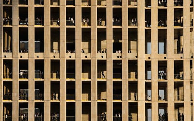 Ultra-Orthodox Jewish men stand on multiple floors of a building under construction and watch a protest against service in the Israeli military, in Jerusalem, Thursday, Oct. 30, 2025. (AP Photo/Ohad Zwigenberg) Ultra-Orthodox Jewish men stand on multiple floors of a building under construction and watch a protest against service in the Israeli military, in Jerusalem, Thursday, Oct. 30, 2025. (AP Photo/Ohad Zwigenberg)