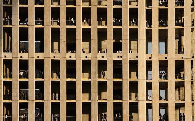 Ultra-Orthodox Jewish men stand on multiple floors of a building under construction and watch a protest against service in the Israeli military, in Jerusalem, Thursday, Oct. 30, 2025. (AP Photo/Ohad Zwigenberg) Ultra-Orthodox Jewish men stand on multiple floors of a building under construction and watch a protest against service in the Israeli military, in Jerusalem, Thursday, Oct. 30, 2025. (AP Photo/Ohad Zwigenberg)