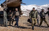 Defense Minister Israel Katz (left) and his military secretary, Brig. Gen. Guy Markizeno get off an Israeli Air Force helicopter in the Mount Hermon area in southern Syria, March 11, 2025. (Emanuel Fabian/Times of Israel)