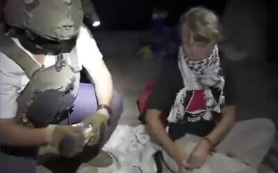 An Israeli soldier detains Swedish campaigner Greta Thunberg aboard a ship in the Global Sumud Flotilla of anti-Israel activists, in video released by the Foreign Ministry on October 1, 2025. (X screenshot) An Israeli soldier detains Swedish campaigner Greta Thunberg aboard a ship in the Global Sumud Flotilla of anti-Israel activists, in video released by the Foreign Ministry on October 1, 2025. (X screenshot)
