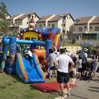 Jewish families celebrate the Sukkot holiday at the Jewish settlement of Efrat, October 16, 2019. (Gershon Elinson/Flash90)