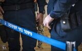 Illustrative. Handcuffs, in a Jerusalem court on November 21, 2022. (Olivier Fitoussi/ Flash90)