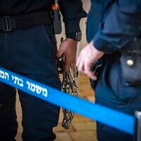 Illustrative. Handcuffs, in a Jerusalem court on November 21, 2022. (Olivier Fitoussi/ Flash90)