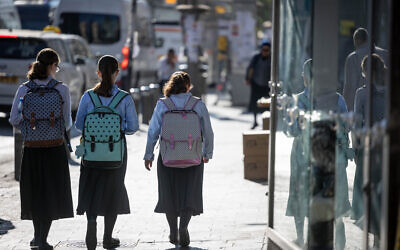 Ultra-Orthodox girls walk to school in the neighborhood of Mea Shearim, Jerusalem, on August 30, 2023. (Chaim Goldberg/Flash90) Ultra-Orthodox girls walk to school in the neighborhood of Mea Shearim, Jerusalem, on August 30, 2023. (Chaim Goldberg/Flash90)
