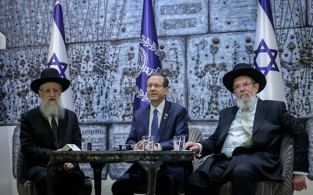 Sephardic Chief Rabbi David Yosef (right) and Ashkenazi Chief Rabbi Kalman Ber (left), with Israel's President Isaac Herzog during their swearing-in ceremony at the President Residence in Jerusalem, on November 4, 2024. (Chaim Goldberg/Flash90)