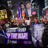 A sign urging US President Donald Trump to end the war in Gaza is hoisted during a rally demanding a ceasefire-hostage deal, outside the IDF headquarters in Tel Aviv, September 30, 2025. (Avshalom Sassoni/Flash90)