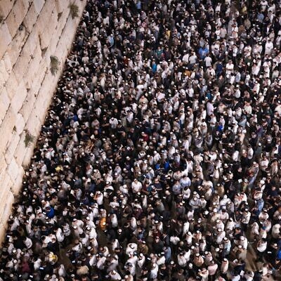 Jews praying for forgiveness (Selichot), at the Western Wall in the Old City of Jerusalem, early on October 1, 2025, on the eve of the Jewish holiday of Yom Kippur. (Chaim Goldberg/Flash90)